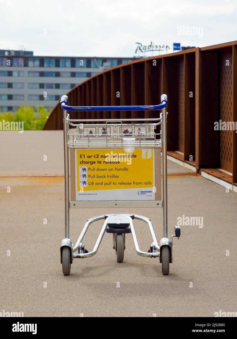 Manchester UK April 18, 2022 suit case airport trolley discarded outside airport Manchester International Stock Photo