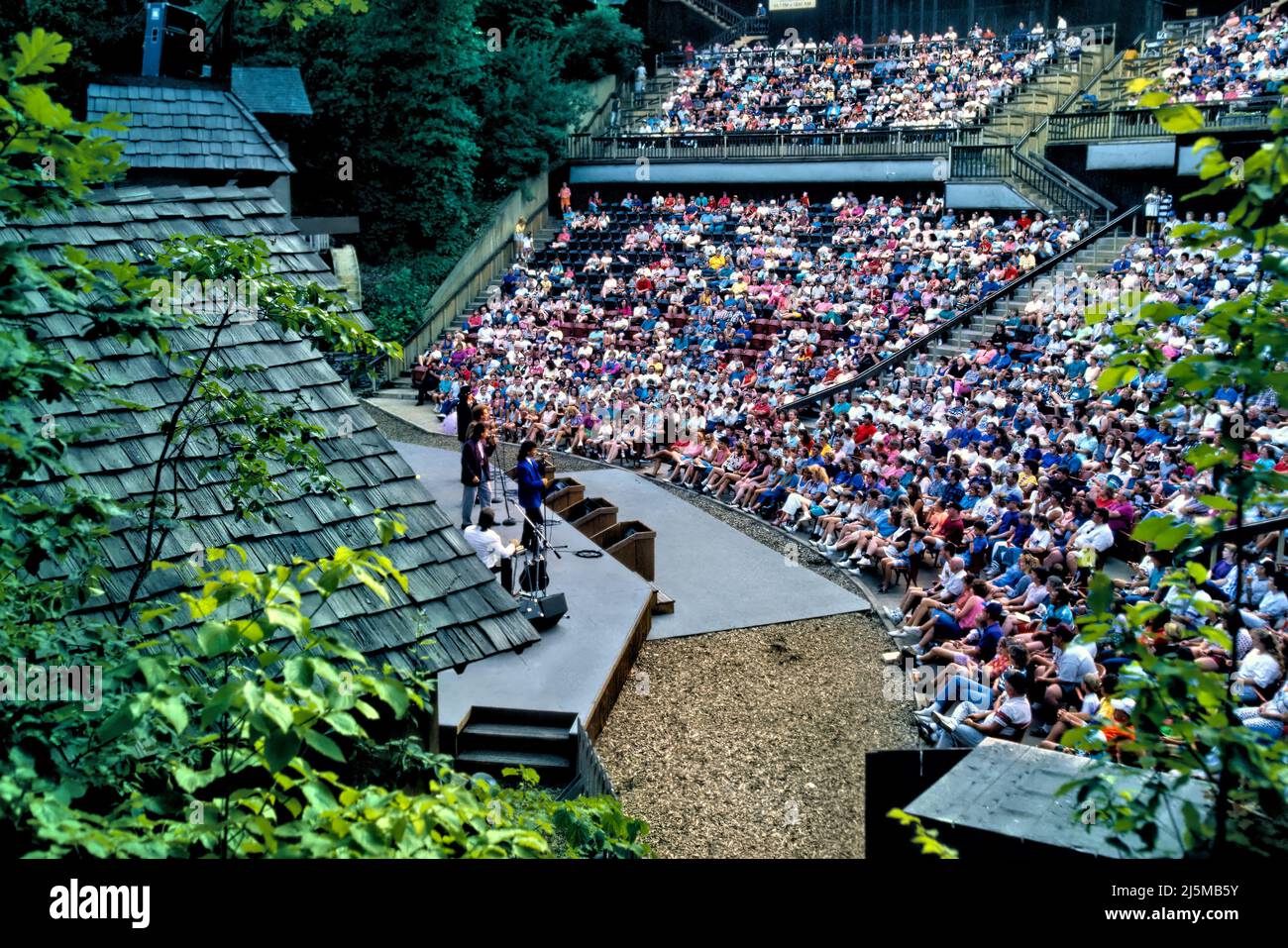 A summer evening concert at Echo Hollow Amphitheatre in Silver Dollar City near Branson, Missouri provides entertainment for hundreds. Stock Photo