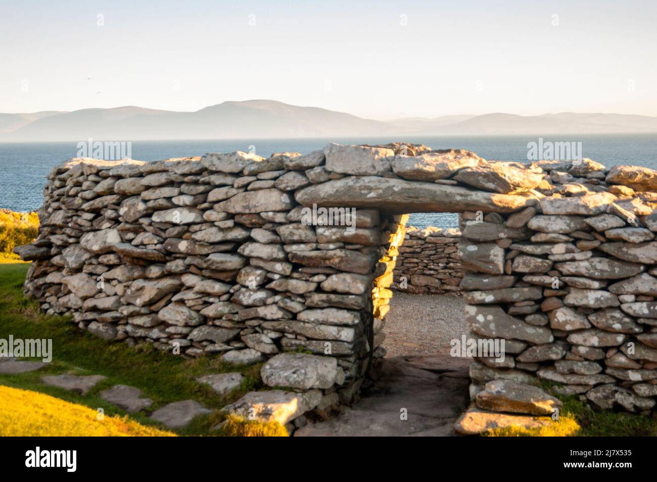 Dunbeg Fort on Dingle Bay in Ireland across to the Macgillycuddy's Reeks, Ireland. Stock Photo