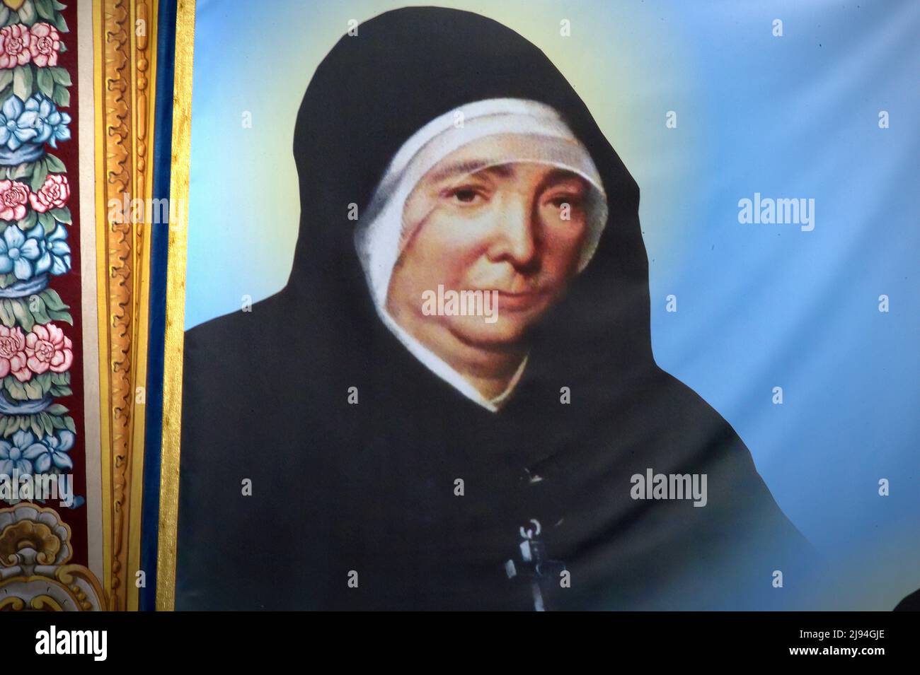 Marie Rivier,Tapestry hanging in St. Peter's Square in the Vatican.Pope Francis names ten new saints during a canonization mass in St. Peter's Square, on May 15, 2022 in Vatican City, Vatican. At the beginning of the liturgical celebration, the Pope proclaimed new saints: Titus Brandsma, Lazzarus Devasahayam, César de Bus, Luigi Maria Palazzolo, Giustino Maria Russolillo, Charles de Foucauld, Maria Rivier, Maria Francesca of Jesus Rubatto, Maria of Jesus Santocanale and Maria Domenica Mantovani, five from Italy, three from France, one from India and one from the Netherlands. on May 15, 2022 Stock Photo