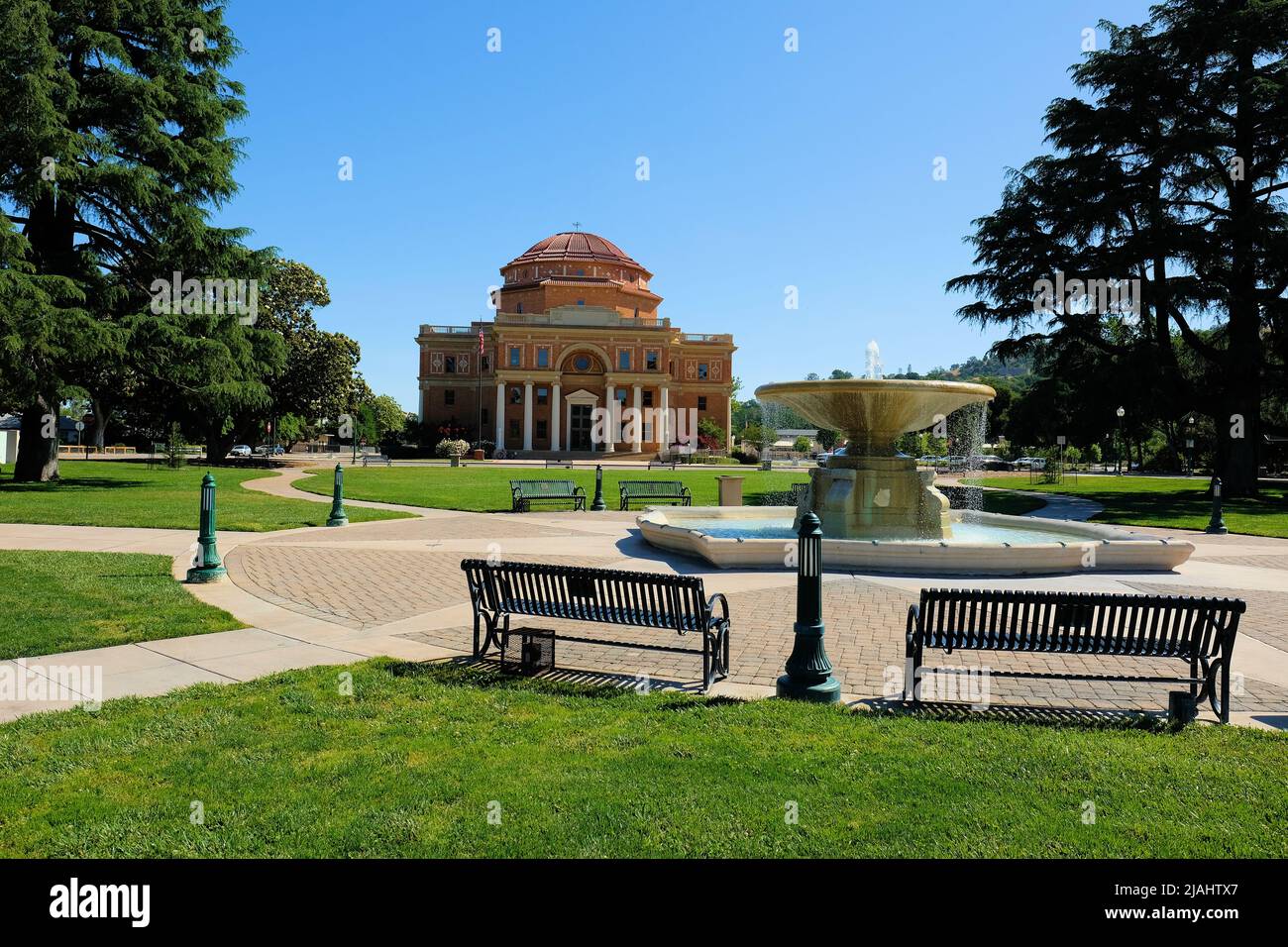 Fountain at Sunken Gardens with the Atascadero, California City Hall in background; City Hall is California State Historical Landmark number 958. Stock Photo