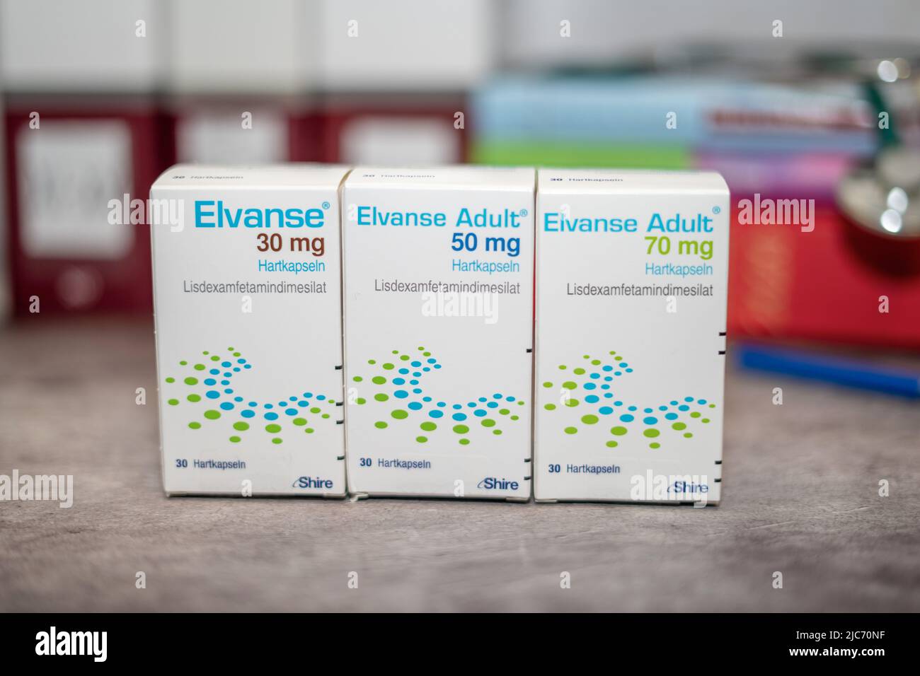 Drug box of  Elvanse containing Lisdexamfetamine for treatment of   attention deficit hyperactivity disorder,on a table and in the background differen Stock Photo