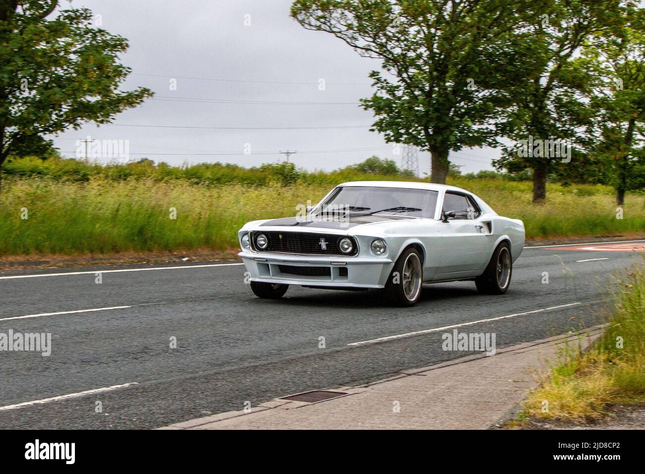 1969 60 sixties white Ford Mustang 4501cc petrol American Pony Car; classic, modern classic, supercars and specialist vehicles en-route to Lytham St Annes, Lancashire, UK Stock Photo