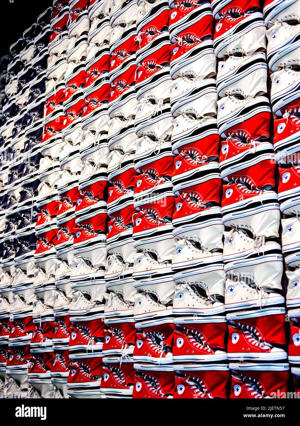 Converse All-Star Chuck Taylor Shoes in red white and blue put together to form a US flag Stock Photo