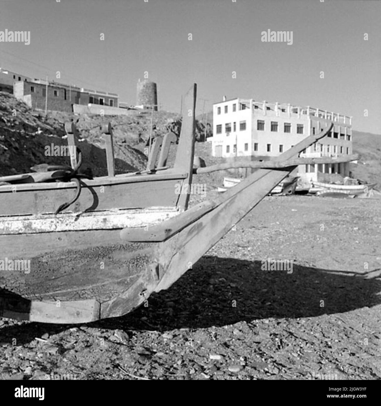 41. Spain. Photo journal is available at B.M.A. + Photo albums. Acquisition: Books and archive materials. Photos taken 1959-11-12.12 Pictures in series. According to notes: Spain. S. Mediterranean coast, Castell de Ferro, 12/11-59. Old -fashioned boat on the beach. A couple of boats are commissioned on a beach. Above the beach is a society. Stock Photo