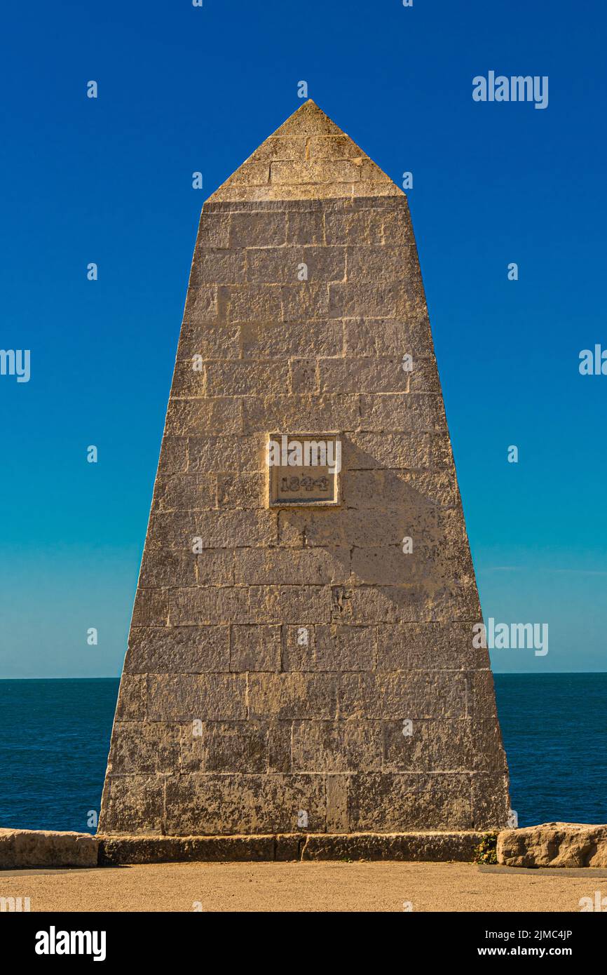 The Trinity House Obelisk or Trinity House Landmark, is a 19th-century obelisk located at Portland Bill, on the Isle of Portland, Dorset, United Kingd Stock Photo