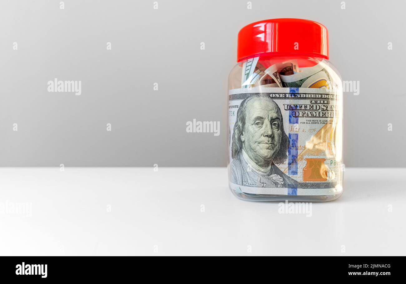 Money in a glass jar. Stock Photo