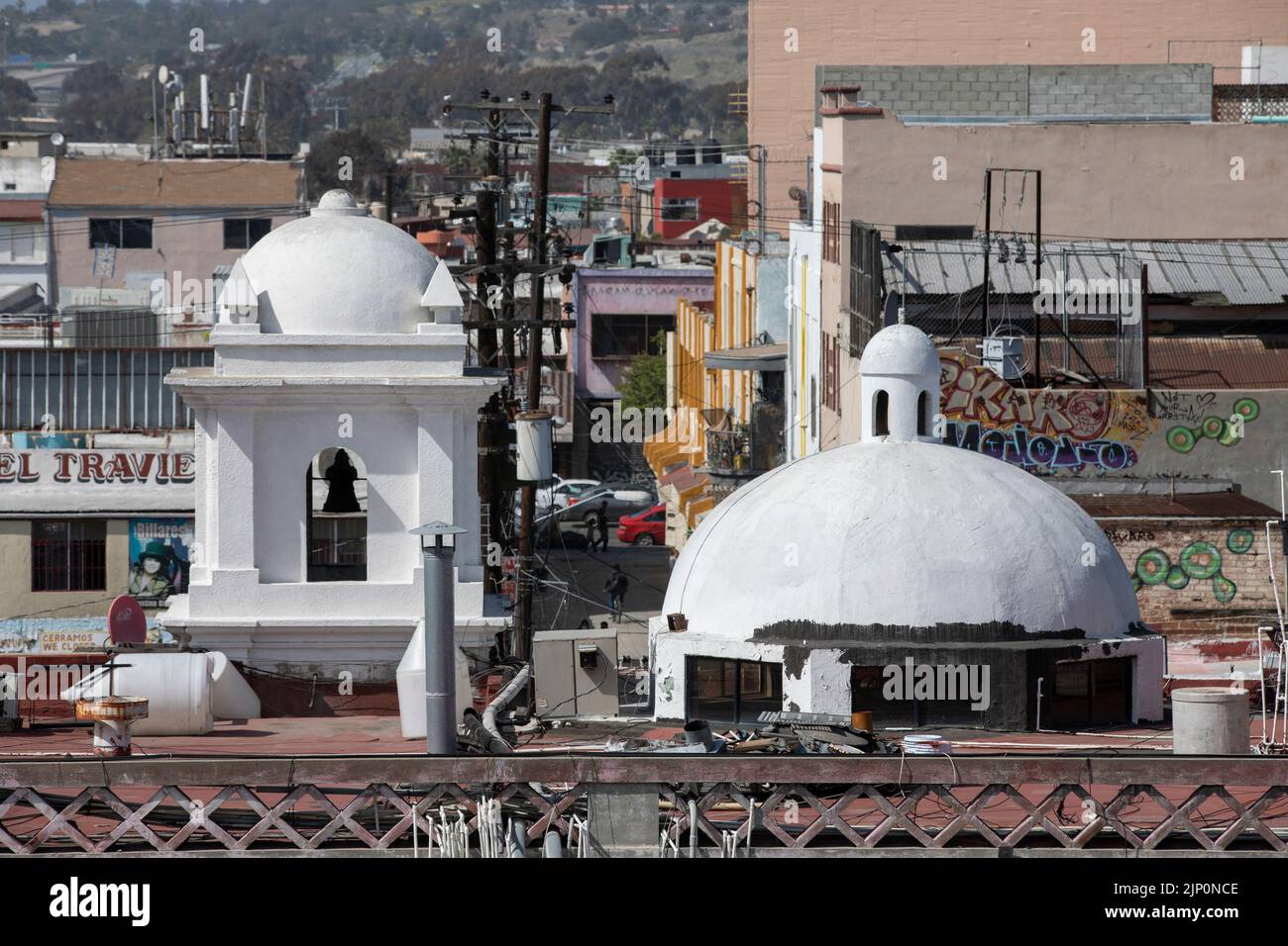 Tijuana, Baja California, Mexico - September 11, 2021: Gang graffiti covers buildings in downtown Tijuana. Stock Photo