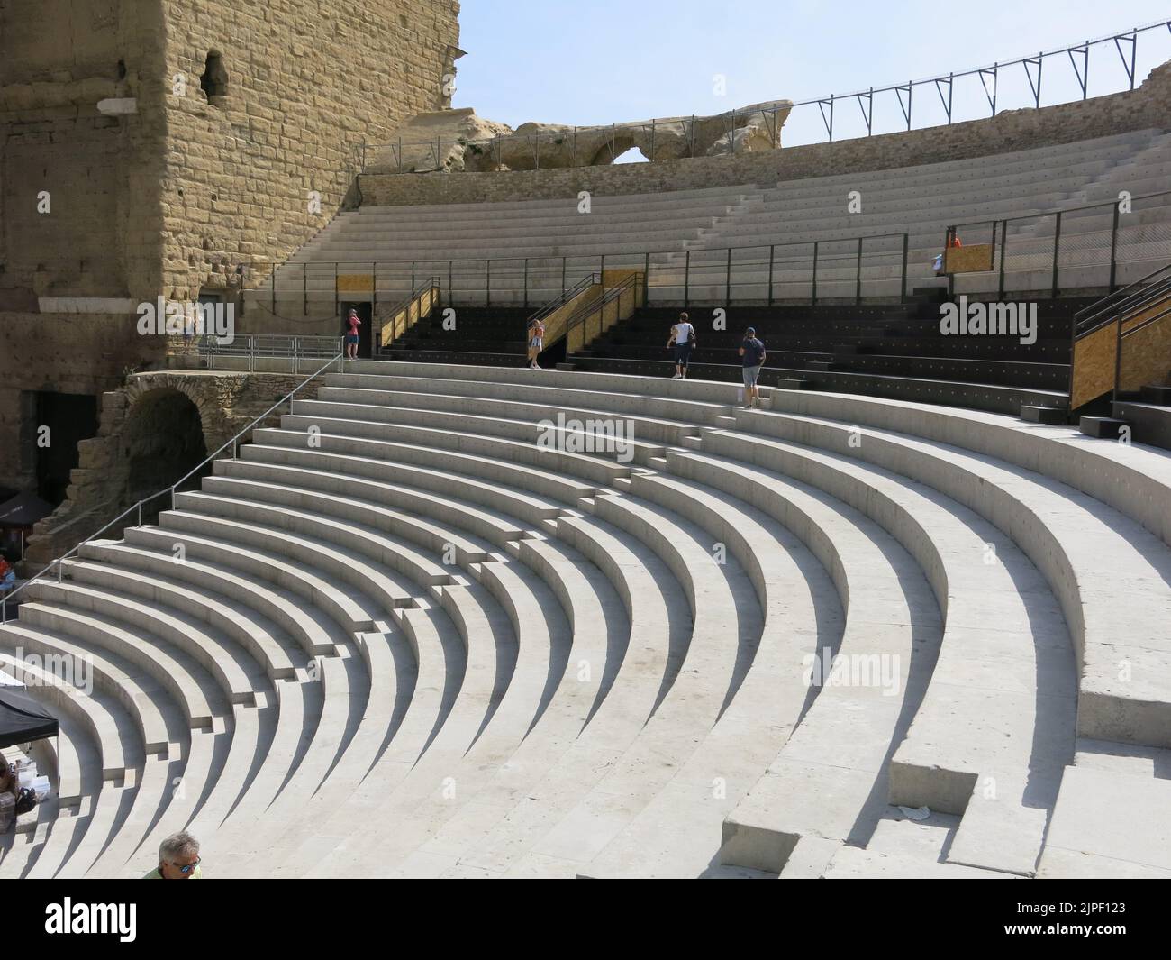 View of the steep stone seating at the outdoor auditorium of the Antique Theatre of Orange, built by the Emperor Augustus in the first century. Stock Photo