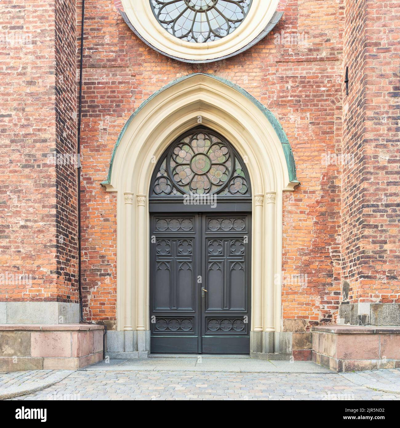 Entrance of Riddarholmen Church, located in the island of Riddarholmshamnen, old city, Gamla stan. before sunset in a summer day, Stockholm, Sweden Stock Photo