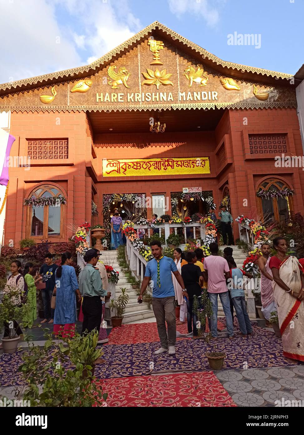 People gathered at Hare Krishna Mandir during Krishna Janmashtami, an annual Hindu festival that celebrates the birth of Krishna Stock Photo