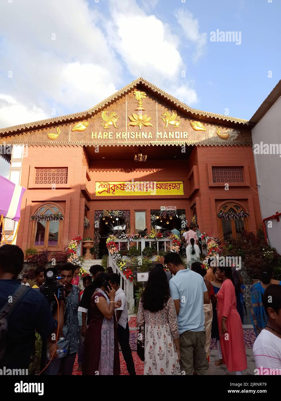 People gathered at Hare Krishna Mandir during Krishna Janmashtami, an annual Hindu festival that celebrates the birth of Krishna Stock Photo