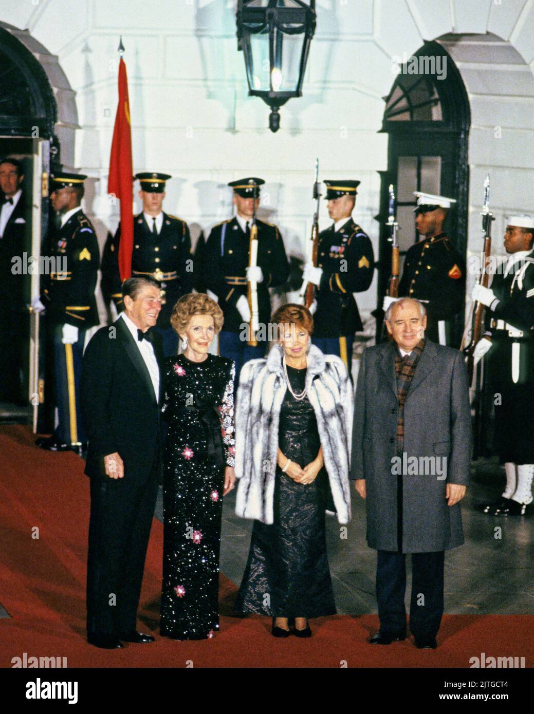 United States President Ronald Reagan, left, and first lady Nancy Reagan, second left, welcome General Secretary of the Central Committee of the Communist Party of the Soviet Union Mikhail Sergeyevich Gorbachev, right, and his wife, Raisa Gorbacheva, right center, to a State Dinner in their honor at the Diplomatic Entrance on the South side of the White House in Washington, DC on December 8, 1987.Credit: Arnie Sachs/CNP *** Please Use Credit from Credit Field *** Credit: Sipa USA/Alamy Live News Stock Photo