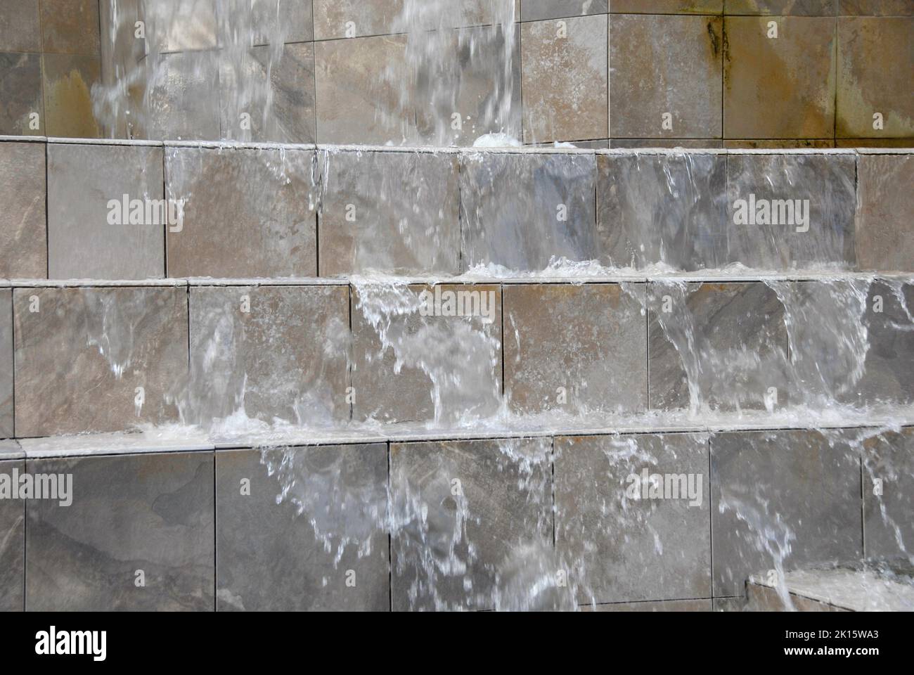 Water cascading down waterfall in hotel grounds, Miami, Florida, USA Stock Photo