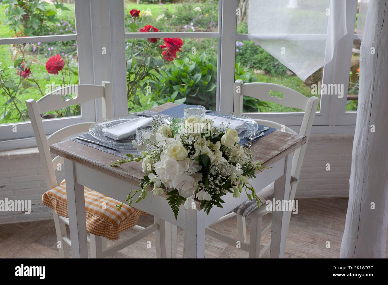 lunch set table in a bay window Stock Photo