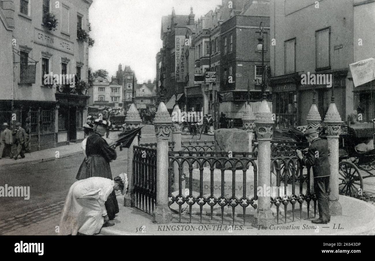 The Coronation Stone - Kingston upon Thames - an ancient sarsen stone block which is believed to have been the site of the coronation of seven Anglo-Saxon kings. It is presently located next to the Guildhall in Kingston upon Thames. Stock Photo