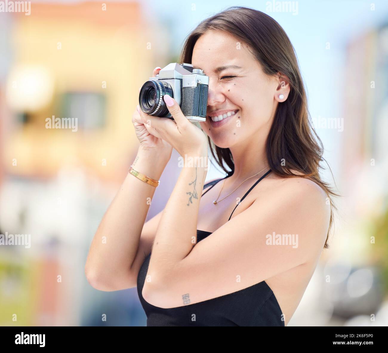 Photographer, city photography and digital camera woman take urban photoshoot for memory on world, global or international travel. Vacation tour Stock Photo