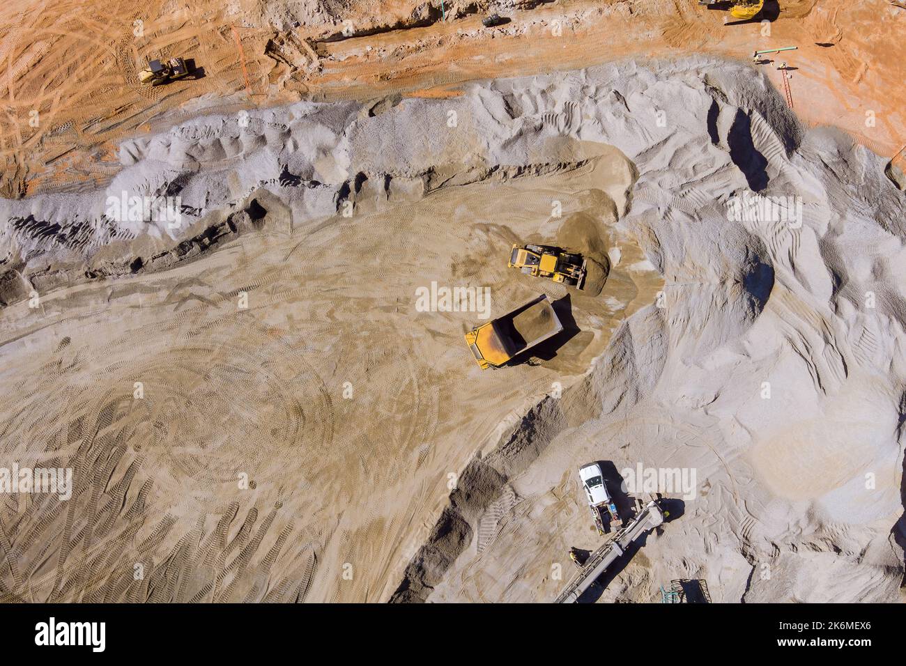 This is view stone crushing machine on mechanical conveyor belt as it grinding up rock stones so that gravel can be produced Stock Photo