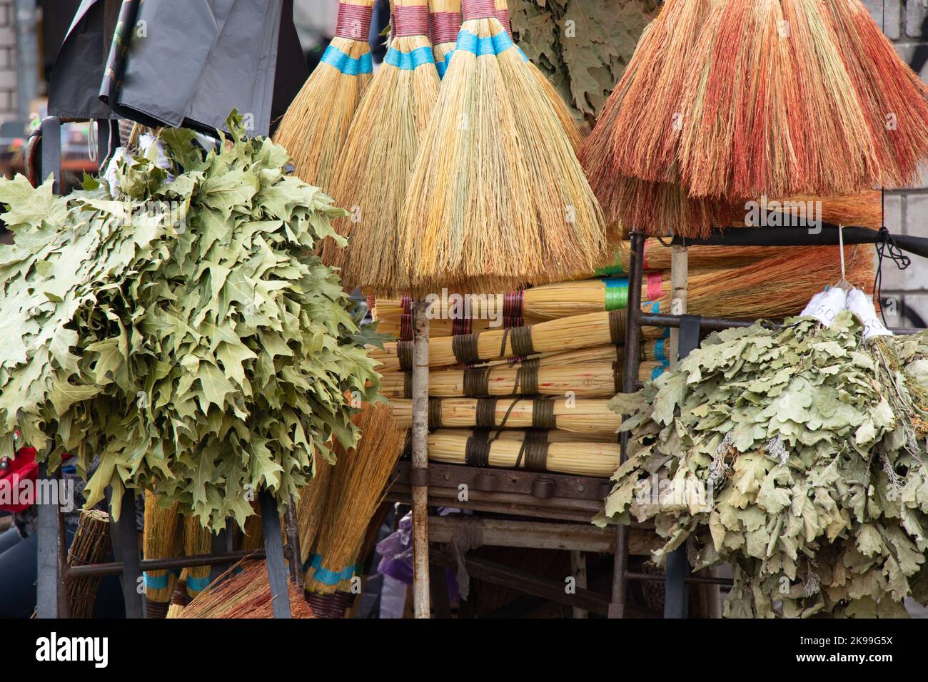 brooms on a window at a bazaar in the city of Dnipro Stock Photo