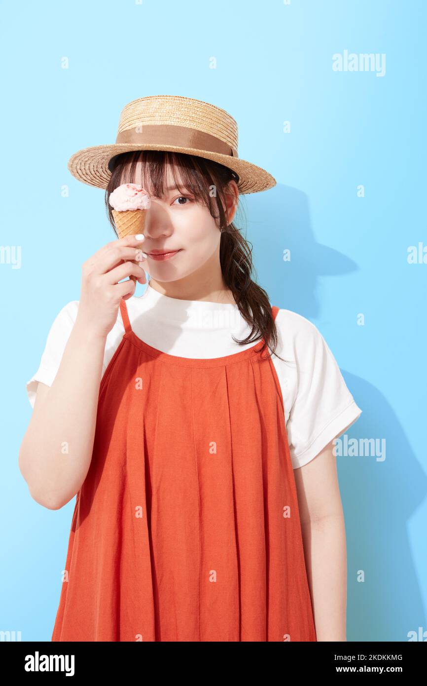 Young Japanese woman eating ice cream Stock Photo