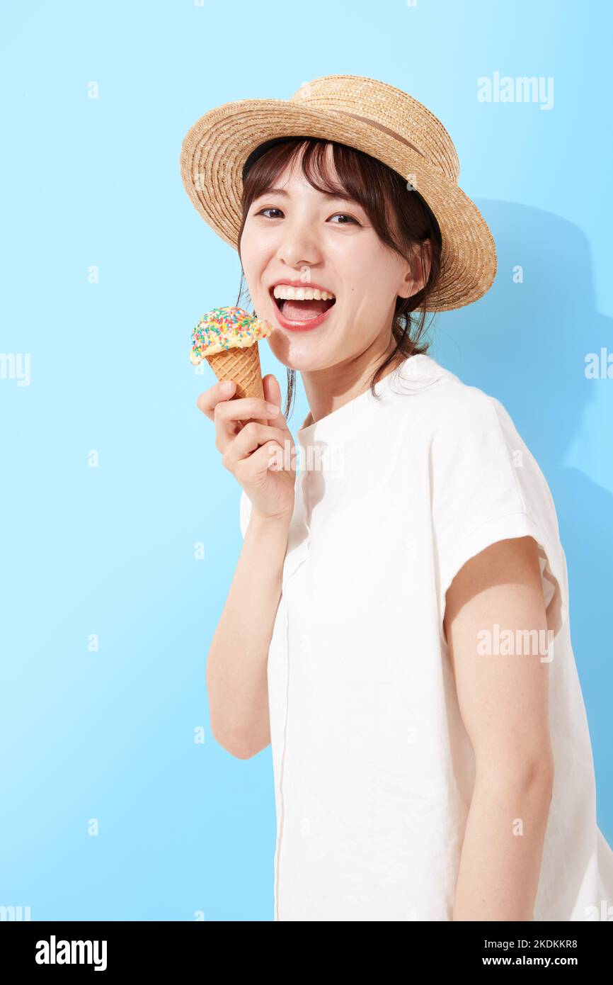 Young Japanese woman eating ice cream Stock Photo