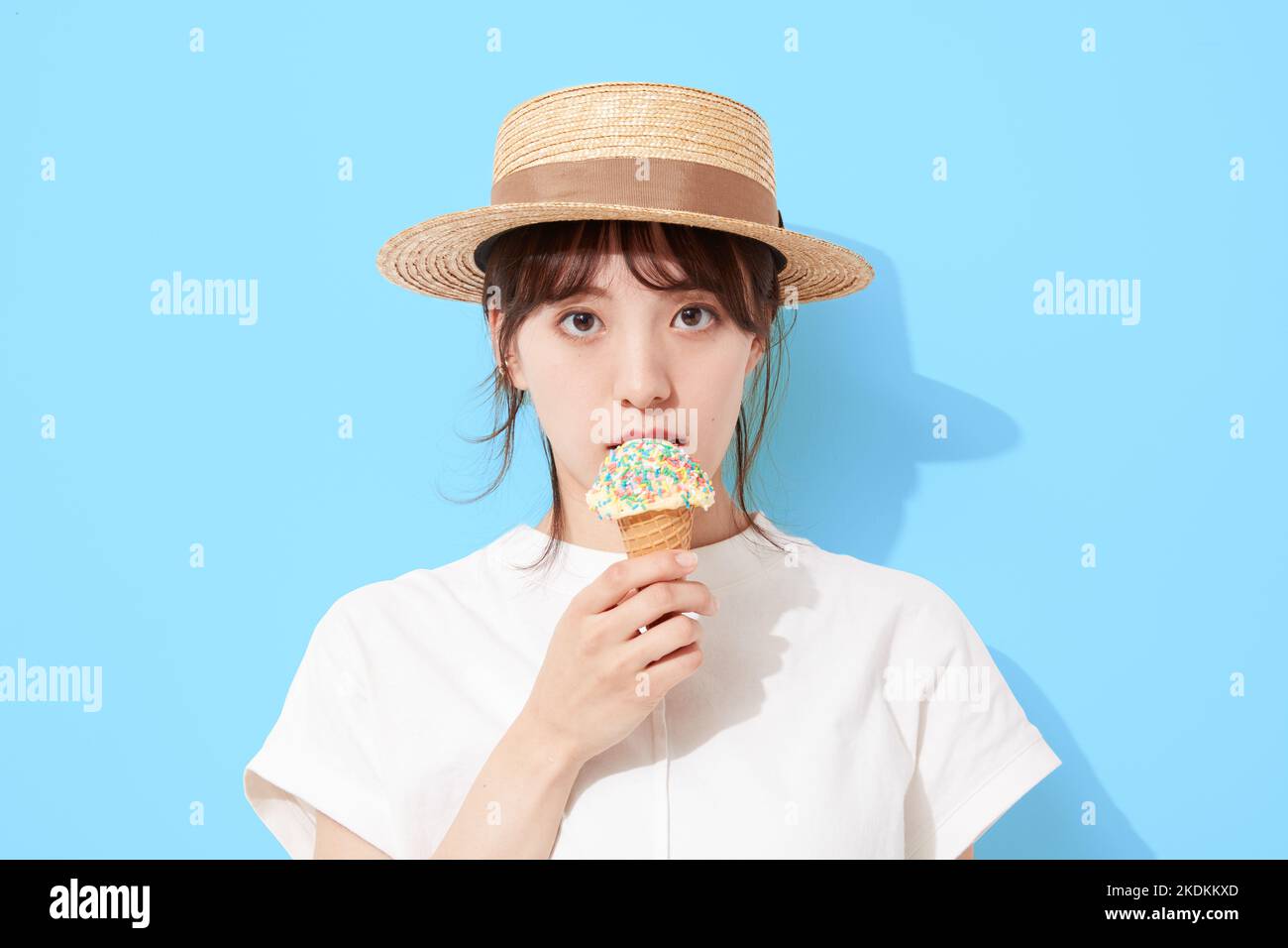 Young Japanese woman eating ice cream Stock Photo