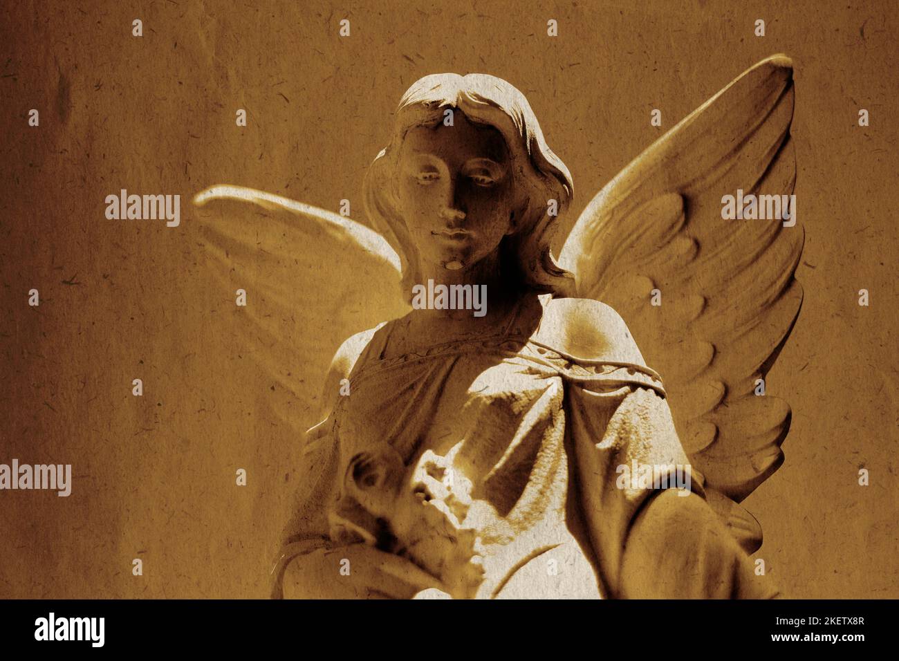 Detail of angel carved in stone statue for religious worship heaven spirituality old weathered paper texture Stock Photo