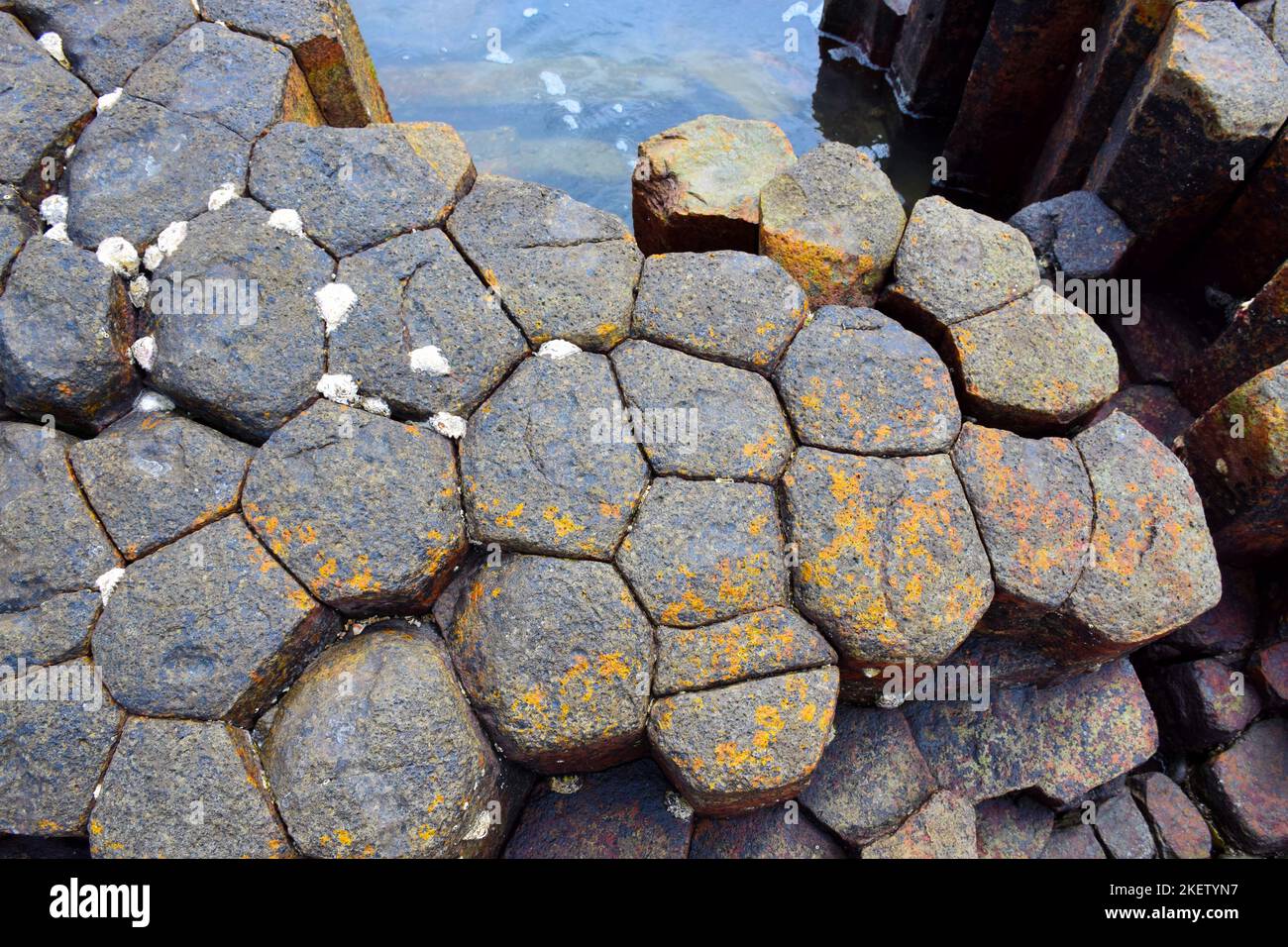 Basalt extrusive igneous rock formed from the rapid cooling of low-viscosity lava rich in magnesium and iron Stock Photo