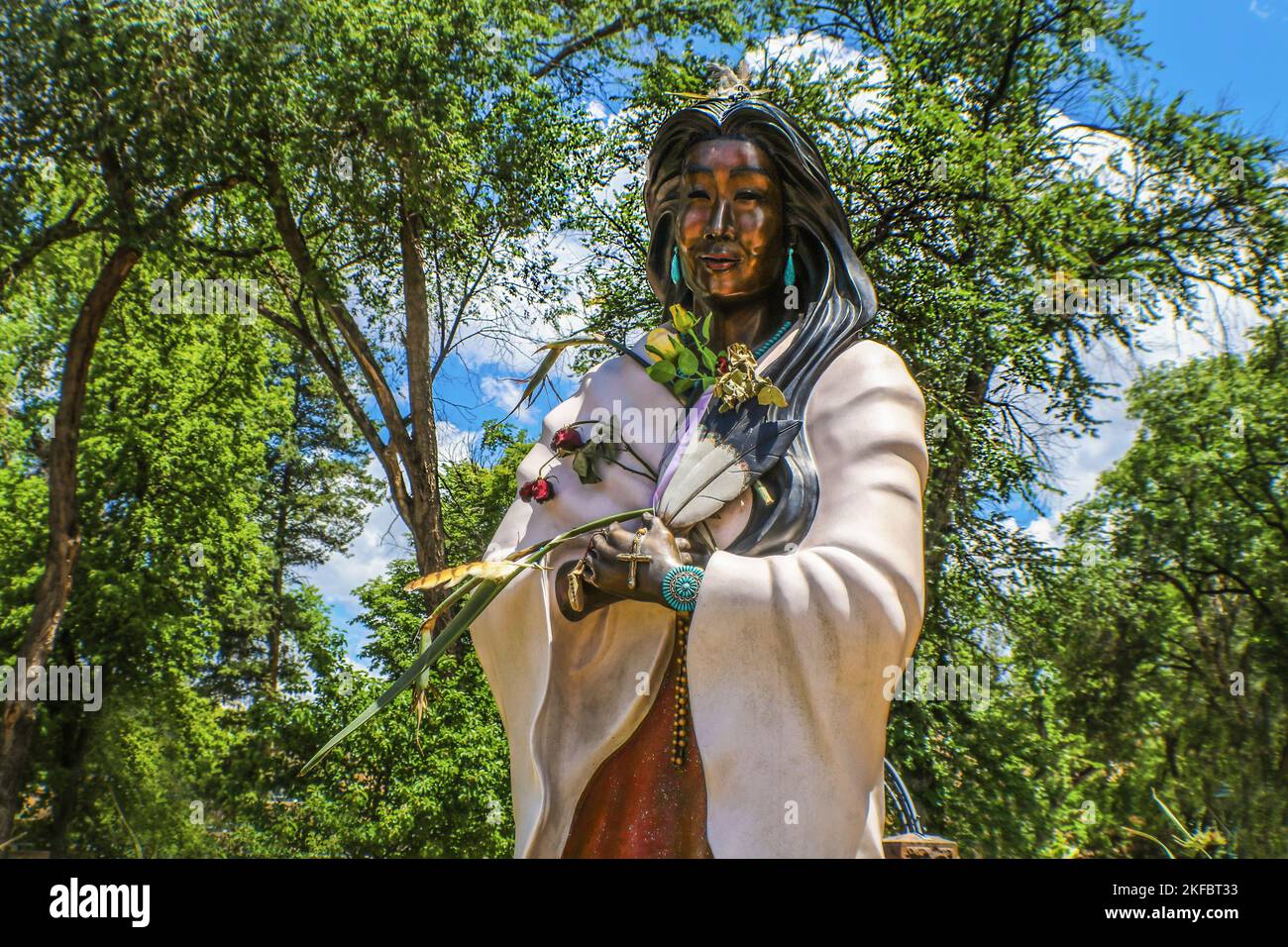 Santa Fe USA 7-19-2017 Kateri Tekakwitha - Catholic saint and Algonquin–Mohawk laywoman-Bronze statue in front of the old Cathedral Basilica of St Fra Stock Photo