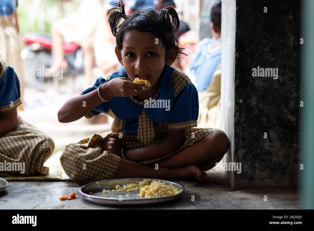 Students having mid day meal at school Stock Photo