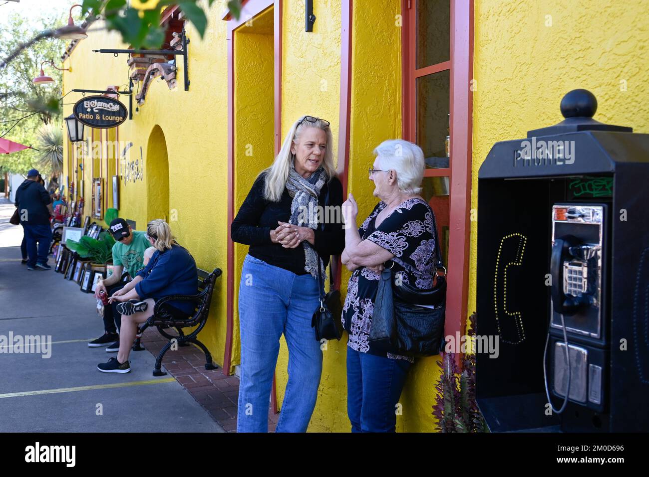 An elusive pay phone outside of El Charro Cafe & Patio, the oldest Mexican Restaurant in the USA, popular with locals and tourists alike, Tucson, AZ Stock Photo