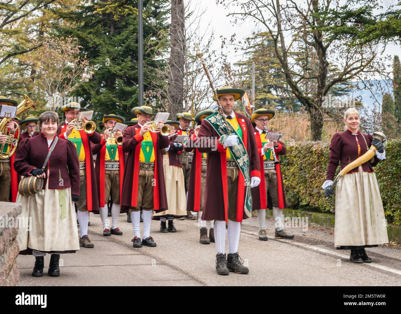 Musicians o the local musical band with their traditional garb - St. Michael  Eppan (San Michele Appiano), Bolzano province, South Tyrol, Italy. Stock Photo