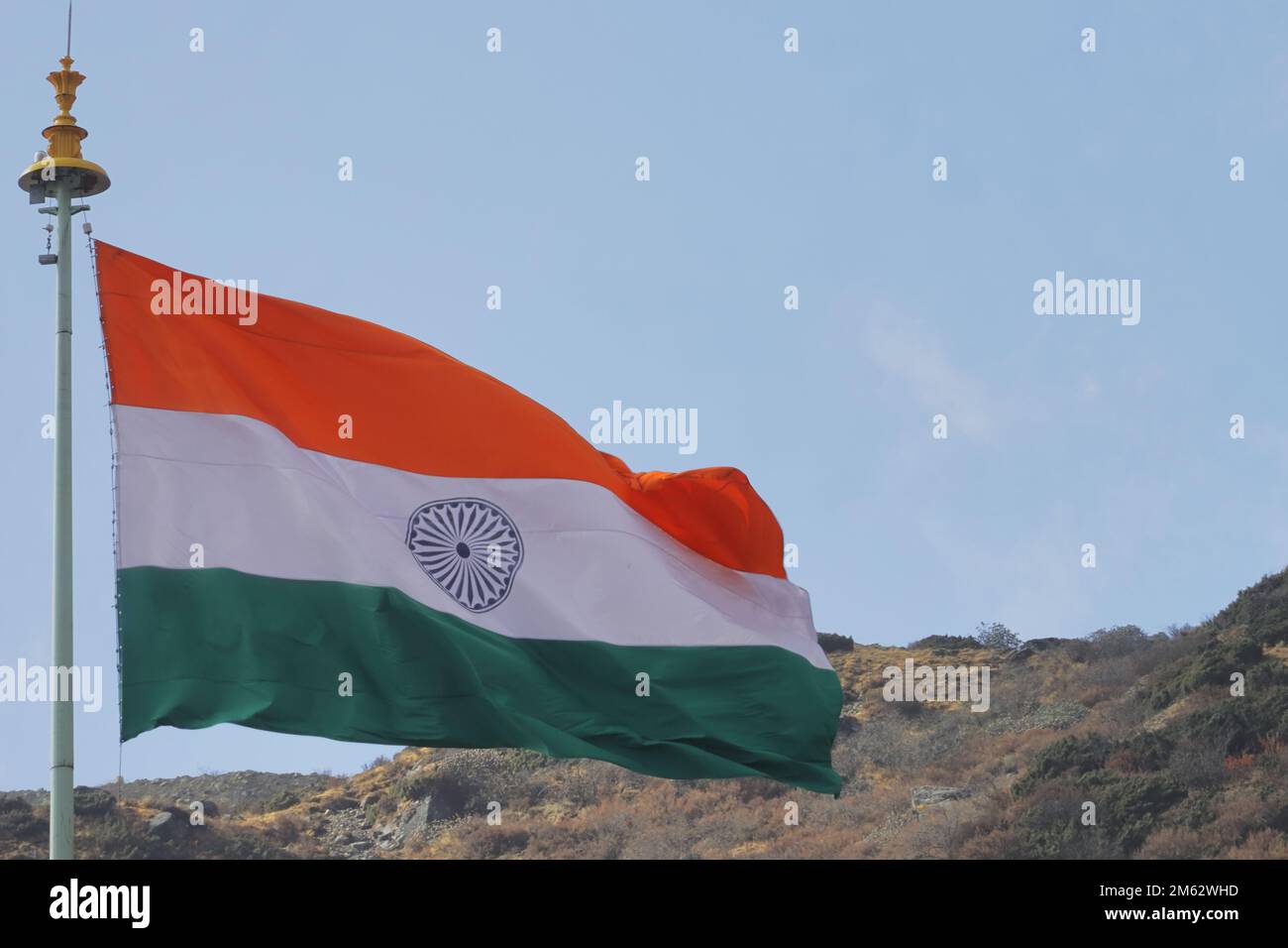 tricolour indian flag flying in the wind near india china border close to the doklam. happy republic day of india Stock Photo