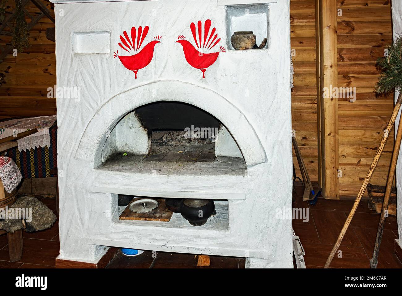 Russian stove without fire in the Russian hut Stock Photo