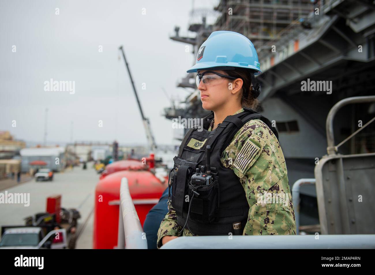 220602-N-EE352-1055 SAN DIEGO (June 2, 2022) Master-at-Arms 3rd Class Ashley Ioppini, a native of Atascadero, Calif., stands watch on the enlisted brow aboard the Nimitz-class aircraft carrier USS Carl Vinson (CVN 70), June 2. Vinson is currently pierside in its homeport of San Diego. Stock Photo