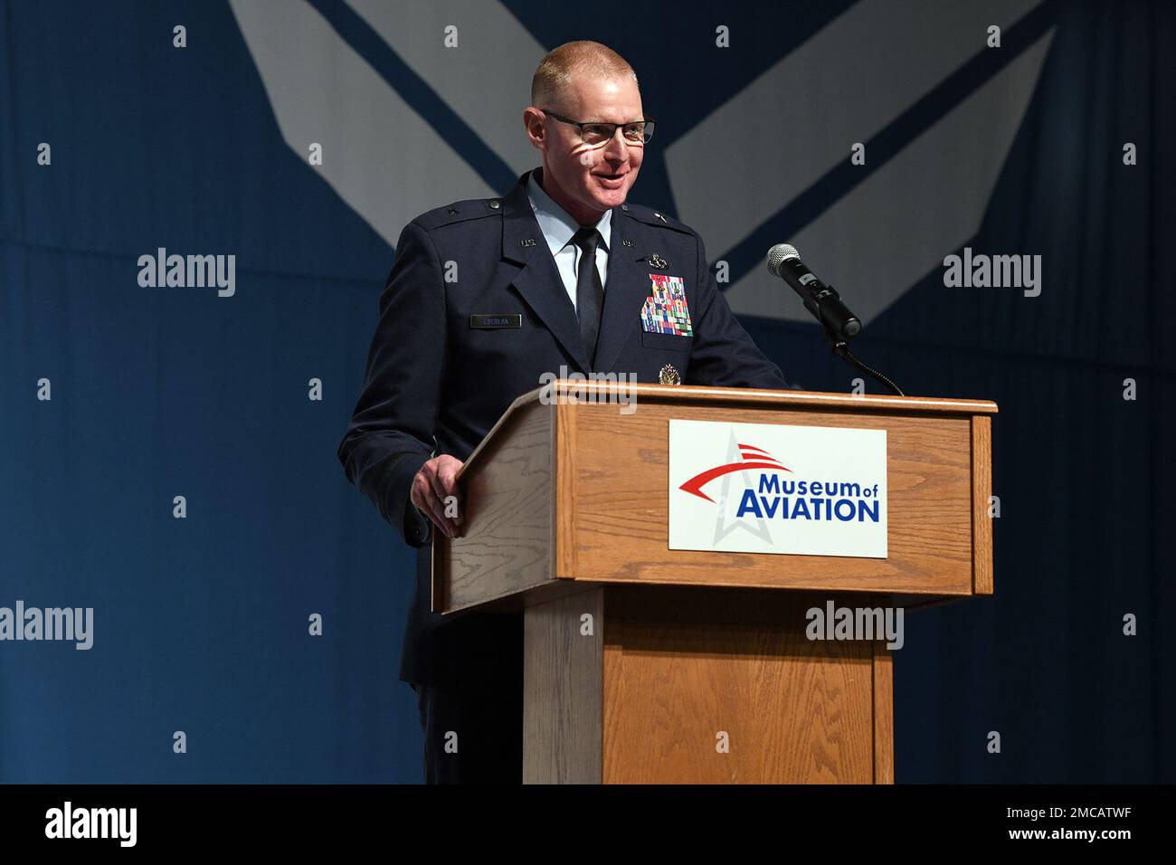 Brig. Gen Jon Eberlan, Warner Robins Air Logistics Complex commander, gives remarks during a change of command ceremony June 28, 2022, at the Museum of Aviation at Robins Air Force Base, Georgia. Prior to taking command of the complex, Eberlan served as the director of budget programs with the Office of the Assistant Secretary of the Air Force for Financial Management and Comptroller. Stock Photo