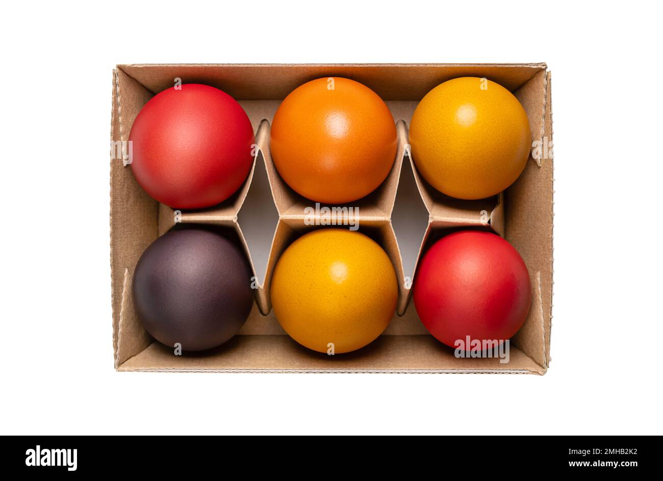 Multicolored Easter eggs, Paschal eggs, in a egg carton. Hard boiled, colorful dyed chicken eggs, used to celebrate the resurrection of Jesus. Stock Photo