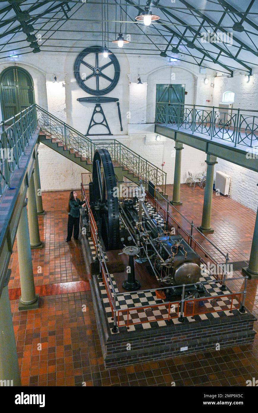 Brighton UK 31st January 2023 - Hannah Daniells Conroy from Bonhams takes a look at the rare 91hp Corliss & Wheelock Horizontal Steam Engine at Hove Engineerium and is being offered for sale at The ConnoisseurÕs Library Sale at Bonhams Knightsbridge on 7-8 February 2023 . The steam engine was built by Crepelle et Garand Lille , France in 1889 is still in working order and has an estimate of £20,000-£30,000.: Credit Simon Dack / Alamy Live News Stock Photo