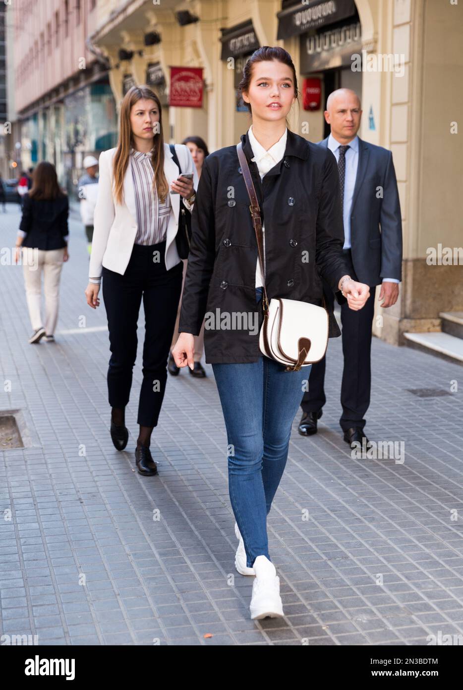 People walking down street in downtown Stock Photo