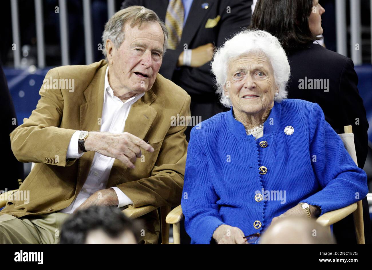 Former President George H. Bush and his wife Barbara Bush arrive before the men's NCAA Final Four college basketball championship game between Connecticut and Butler Monday, April 4, 2011, in Houston. (AP Photo/David J. Phillip) Stock Photo