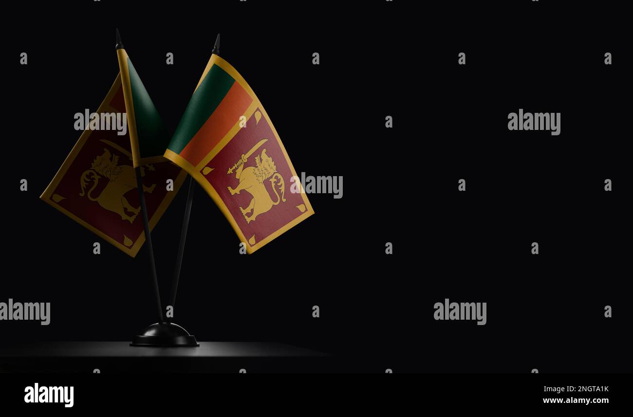 Small national flags of the Sri Lanka on a black background. Stock Photo