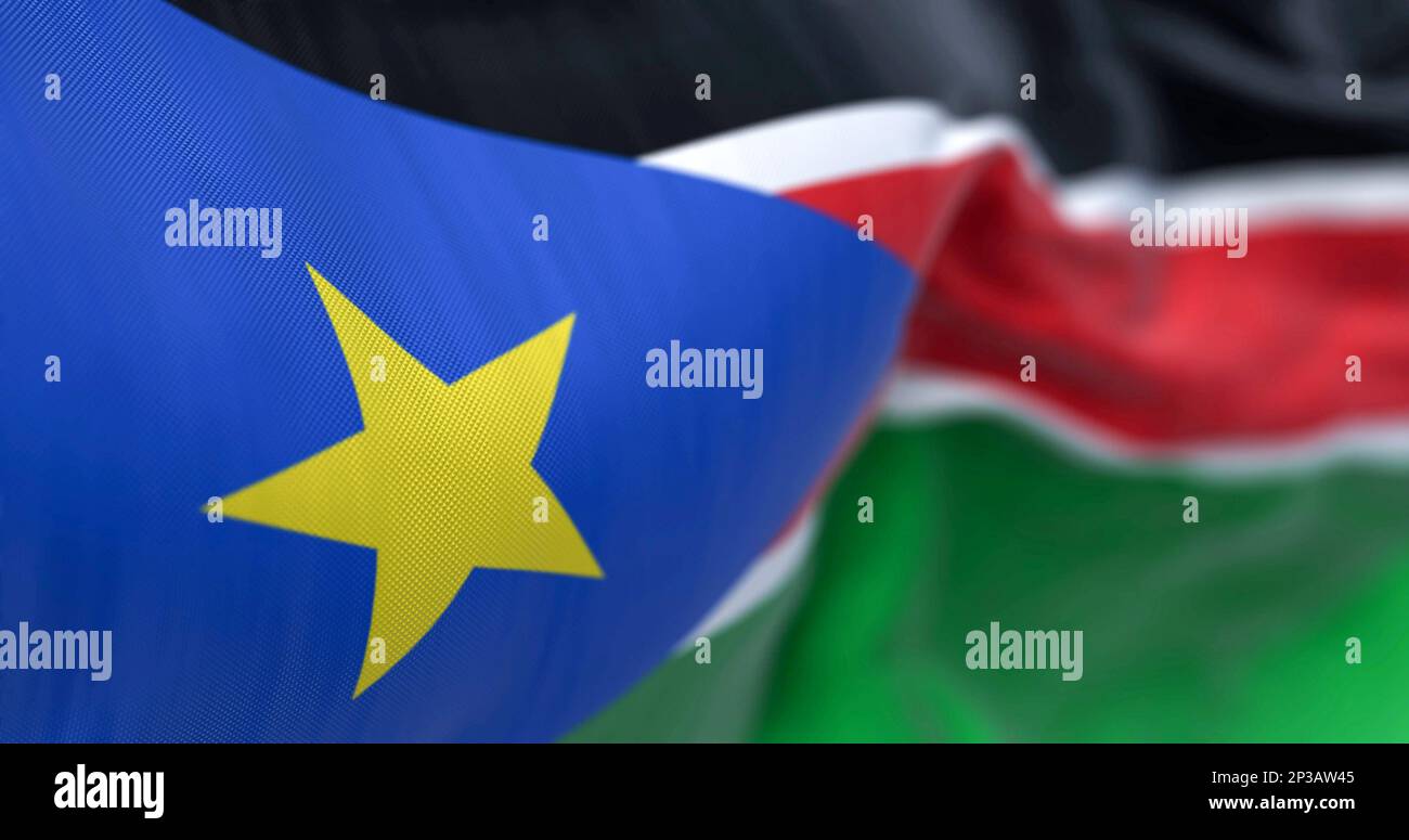 Detail of the South Sudan flag waving. Flag with black, red and green stripes and a gold star on a blue triangle. 3d illustration render. Selective fo Stock Photo