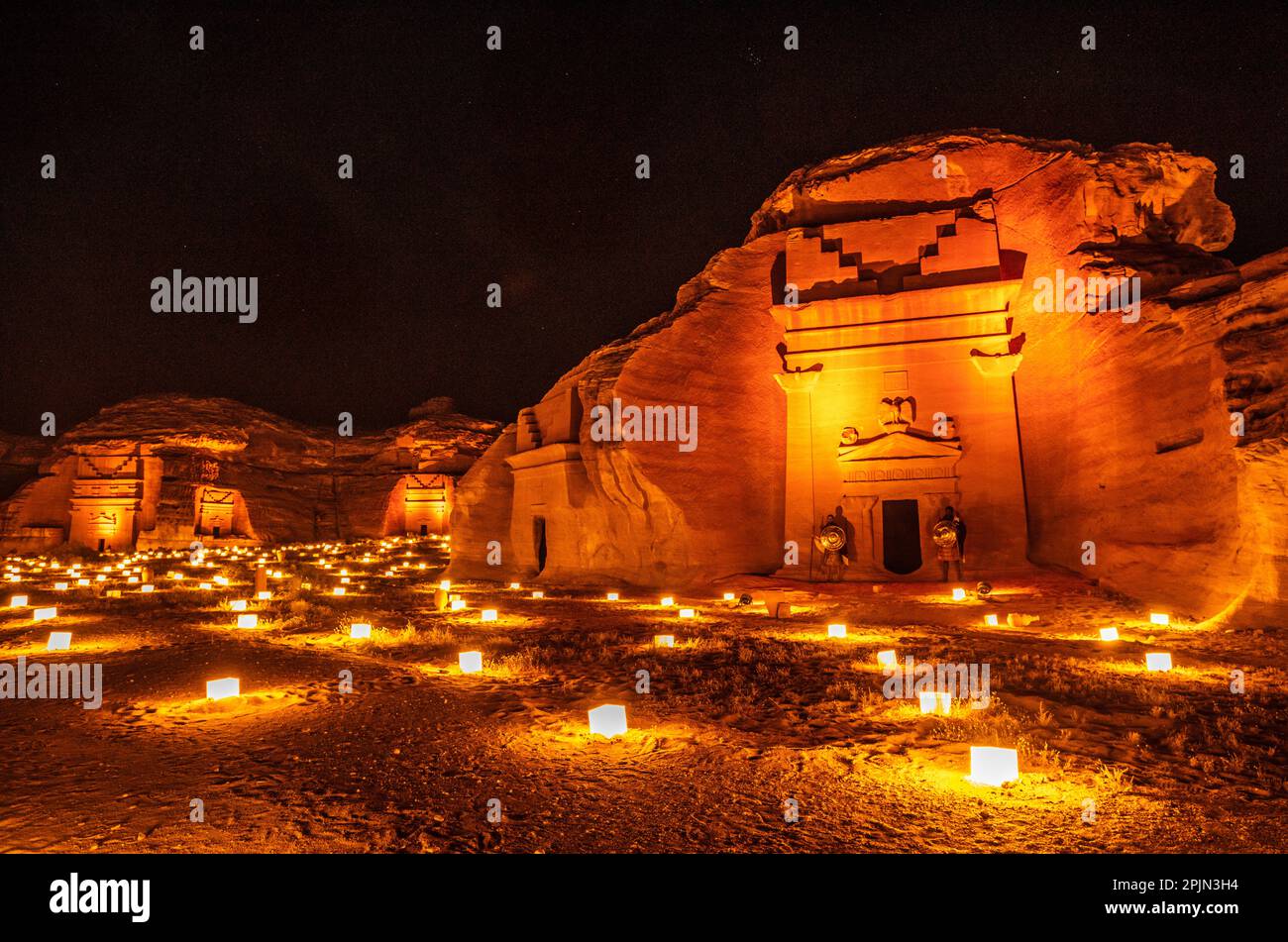 Ancient tombs of Hegra city illuminated during the night, Al Ula, Saudi ...