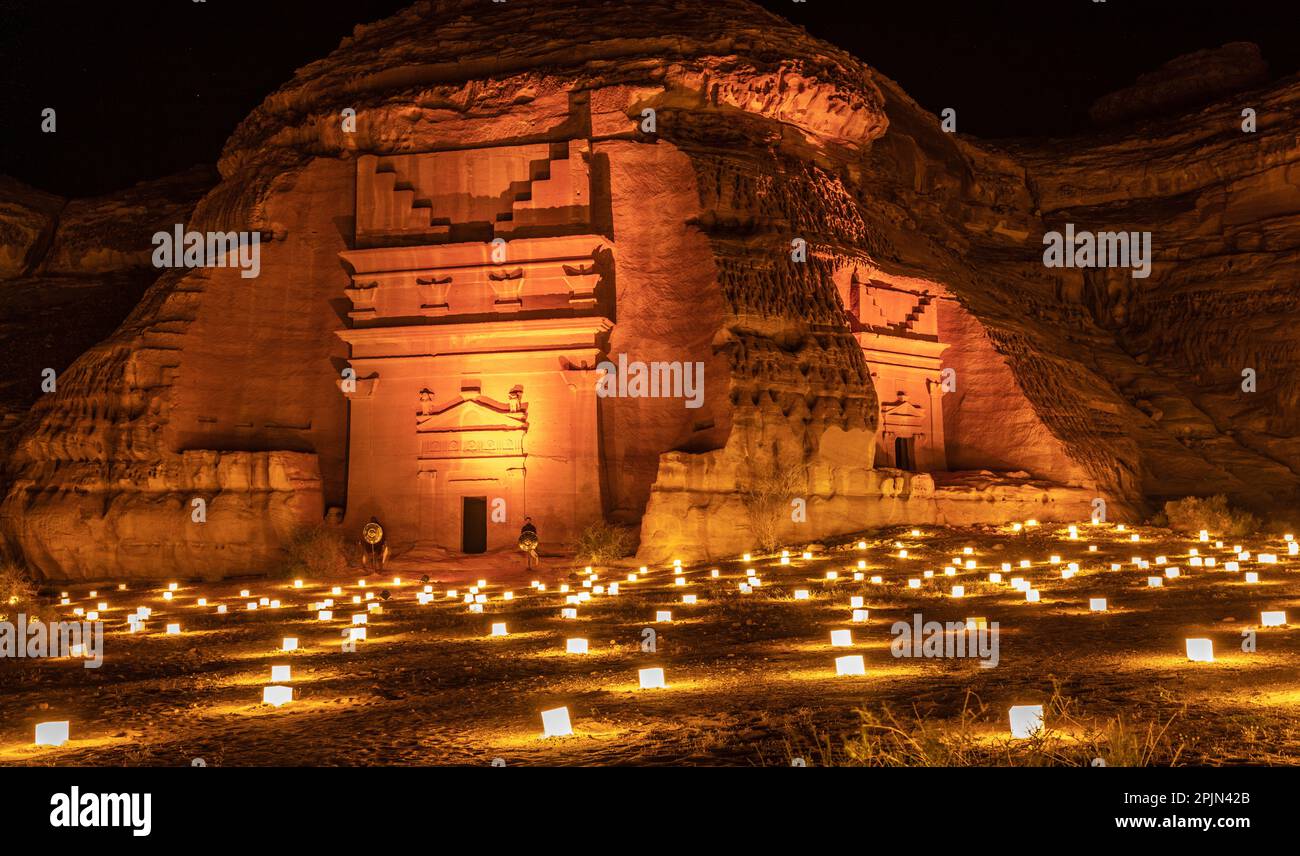 Ancient tombs of Hegra city illuminated during the night, Al Ula, Saudi ...