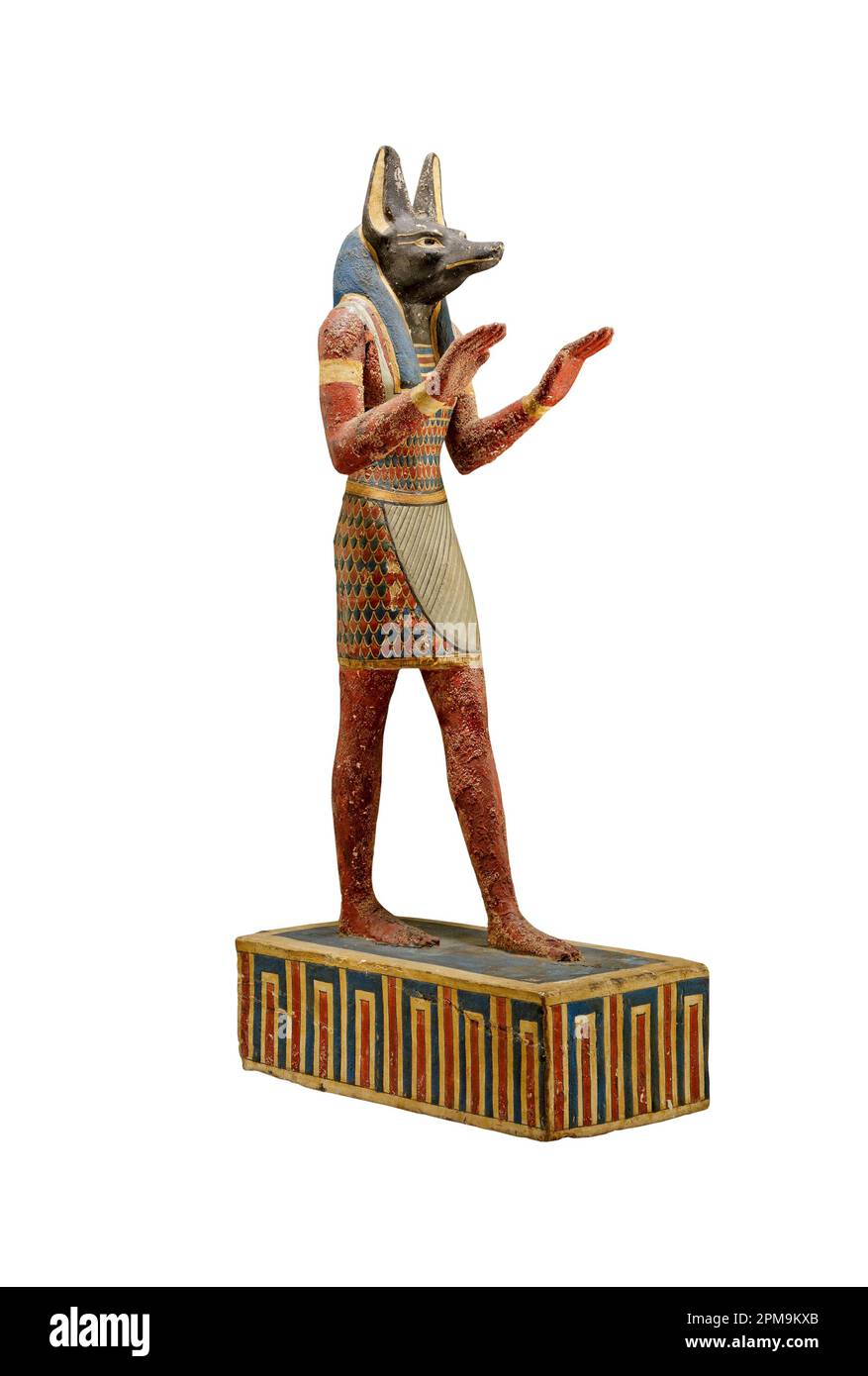 Ancient Egyptian statuette of god Anubis isolated on white background. Anubis is the god of funerary rites, protector of graves, and guide to the unde Stock Photo