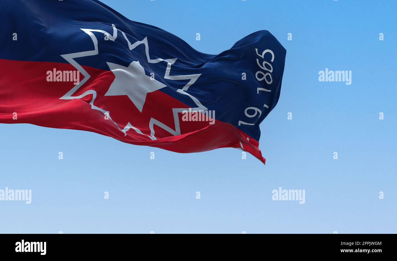 The Juneteenth flag waving in the wind Stock Photo