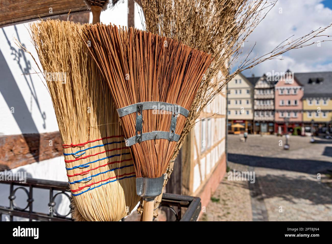 Handmade brooms at workshop of brush maker, market place, Open Air Museum Hessenpark, Neu-Anspach, Taunus, Hesse, Germany Stock Photo