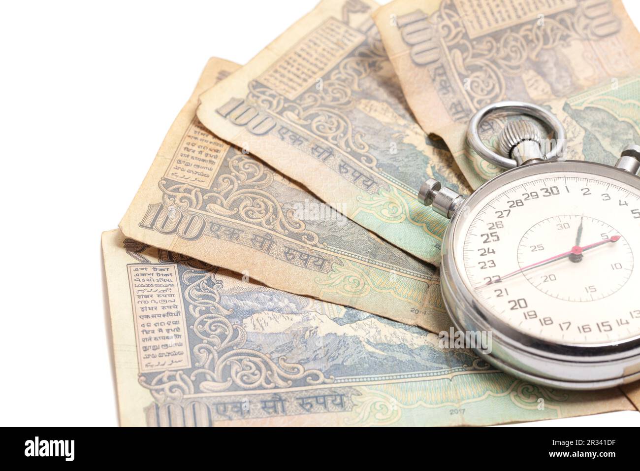 Time is money. Stopwatch and Indian rupees banknotes. Stock Photo