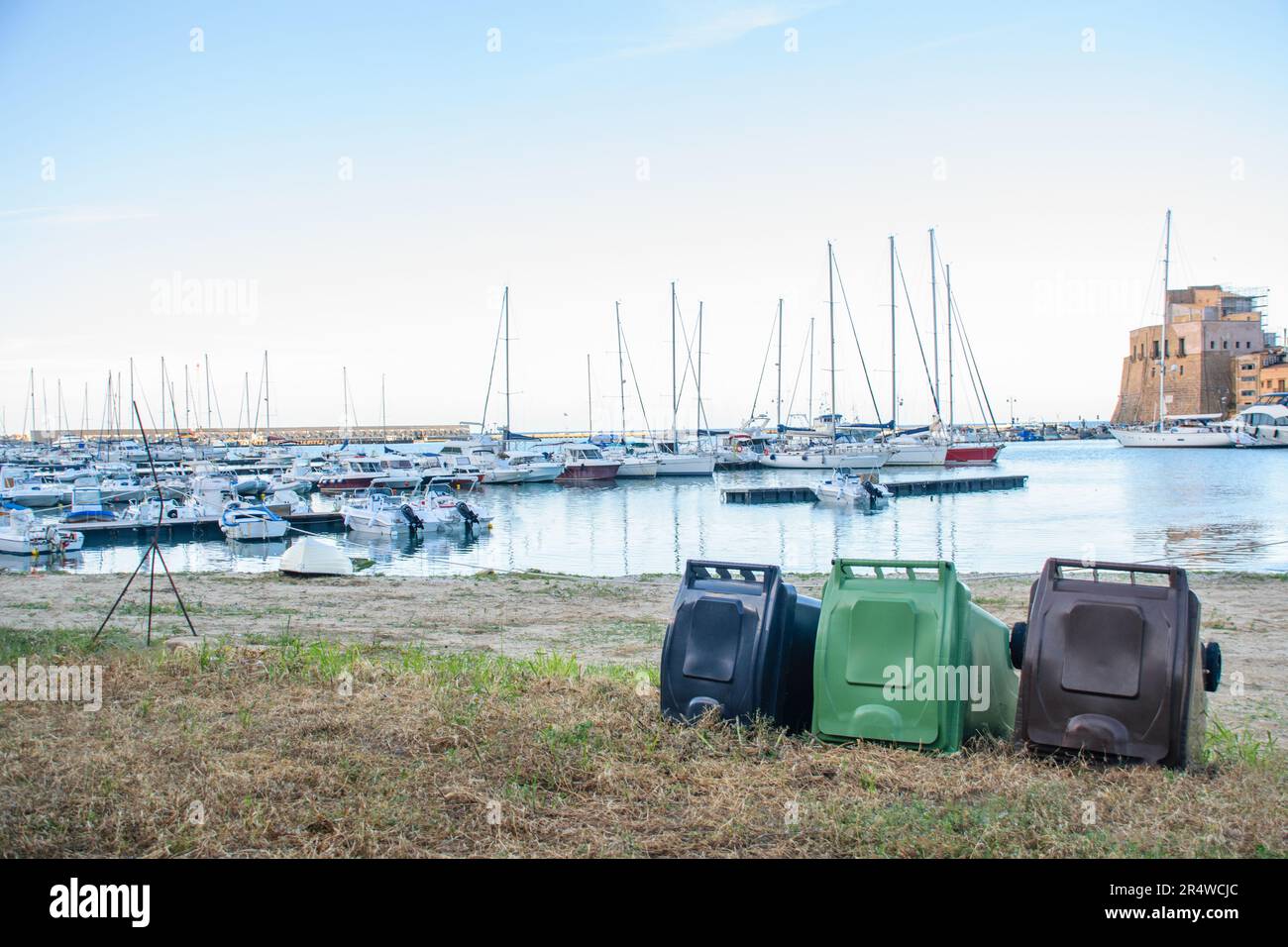 Recycling drums thrown in rustic port dirty by human beings Stock Photo