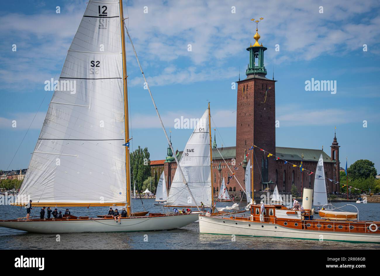 Stockholm, Sweden -June 17 2023: beautiful boats and the city hall in background, Stockholm, Sweden Stock Photo